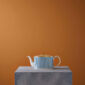Minimalist gallery display on a stone plinth with Wedgwood Helia Teapot in fine bone china with gold banding | Kneen & Co
