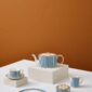 Modern studio display on with Wedgwood Helia Teaware in fine bone china with gold accents | Kneen & Co