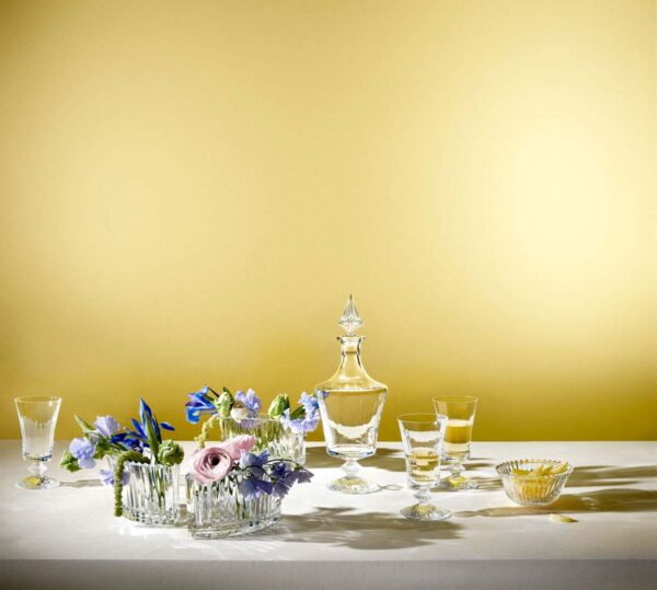 Baccarat Mille Nuits crystal collection featuring stemware, a decanter, bowls, and vases with signature diamond-cut stems and fluted crystal detailing | Kneen & Co