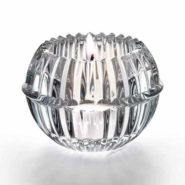 Baccarat Mille Nuits Votive handcrafted in clear French crystal with a beveled petal-inspired silhouette that enhances the glow of candlelight | Kneen & Co