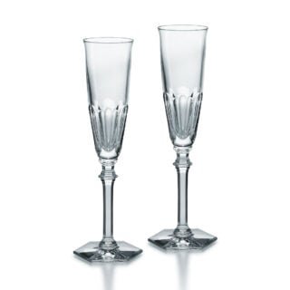 Set of two Baccarat Harcourt Eve Champagne flutes handcrafted in clear French crystal with slender bowls and signature hexagonal feet | Kneen & Co