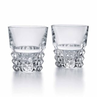 Set of two Baccarat Louxor tumblers handcrafted in clear French crystal with geometric diamond cuts and sculptural faceted interiors | Kneen & Co