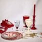 Baccarat Harcourt 1841 Glasses Red, Set of 2 displayed with coordinating Baccarat red crystal décor on a styled tabletop featuring the iconic hexagonal foot and red crystal accents | Kneen & Co