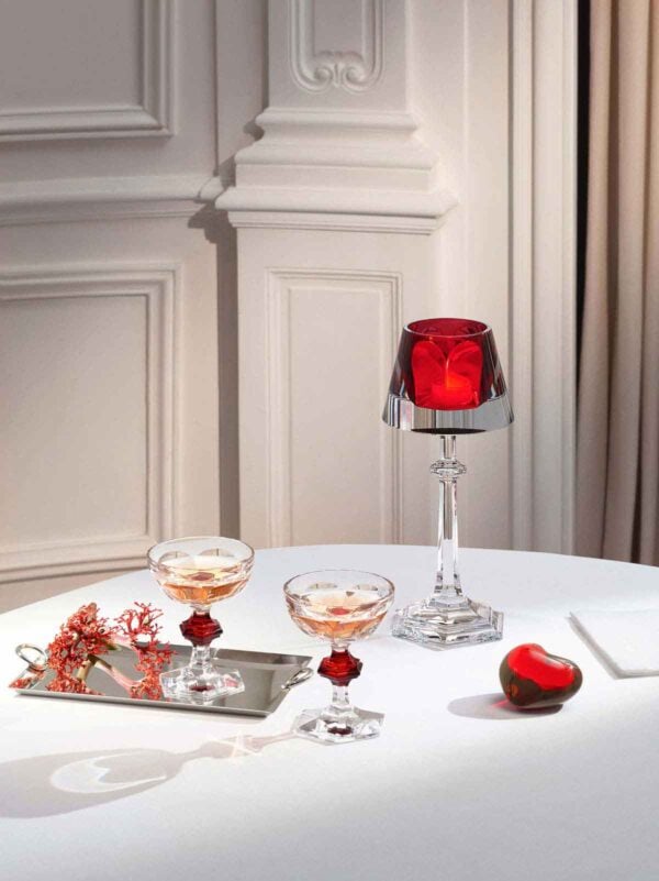 Baccarat Harcourt 1841 Coupes, Set of 2 with signature red crystal accents displayed alongside Baccarat décor on an elegantly styled table | Kneen & Co