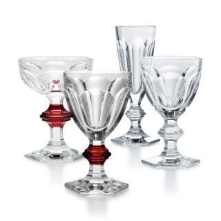Baccarat Harcourt crystal stemware collection featuring wine glasses, champagne flutes, and coupes with the iconic hexagonal foot and beveled stem | Kneen & Co