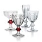 Baccarat Harcourt crystal stemware collection featuring wine glasses, champagne flutes, and coupes with the iconic hexagonal foot and beveled stem | Kneen & Co