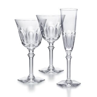 Baccarat Harcourt Eve crystal glassware collection featuring champagne flutes, wine glasses, and water glasses with the collection's signature hexagonal foot | Kneen & Co