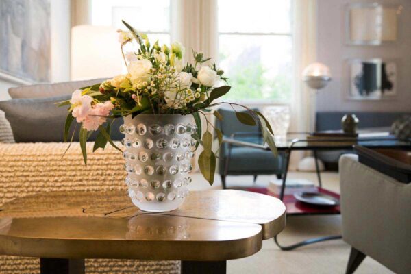 Bright living room setting with a Lalique Mossi Vase in clear crystal | Kneen & Co