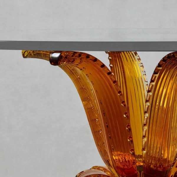 LALIQUE-10747900-Cactus-Table-Additional-Image1-1200w-100KB Close-up studio shot featuring the Lalique Cactus Table with an amber crystal base and a clear glass top | Kneen & Co