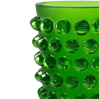 Close-up studio shot featuring the Lalique Mossi Vase in Amazon green crystal, highlighting the vibrant frosted finish and iconic clear cabochon details | Kneen & Co