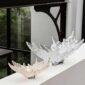 Modern interior featuring the Lalique Champs-Élysées Bowl in clear and gold-stamped crystal, highlighting the sculpted plane tree leaf design | Kneen & Co