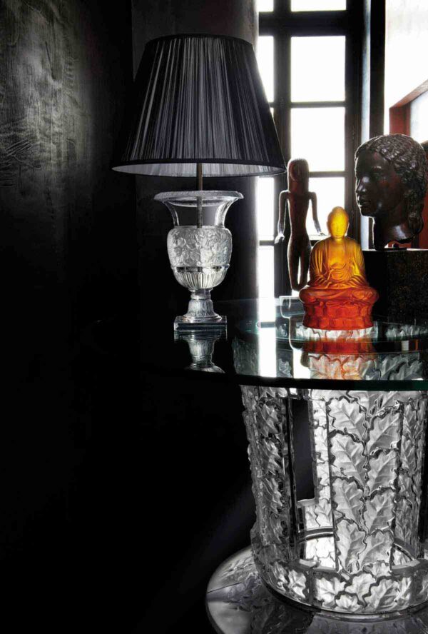 Moody interior setting with a Lalique Versailles Table Lamp in clear satin-finished crystal and a black pleated fabric shade | Kneen & Co