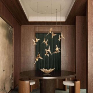 Luxurious dining room featuring the Lalique 2 Swallows Ceiling Lamp Clear Crystal & Gilded Finish in a satin gold finish | Kneen & Co