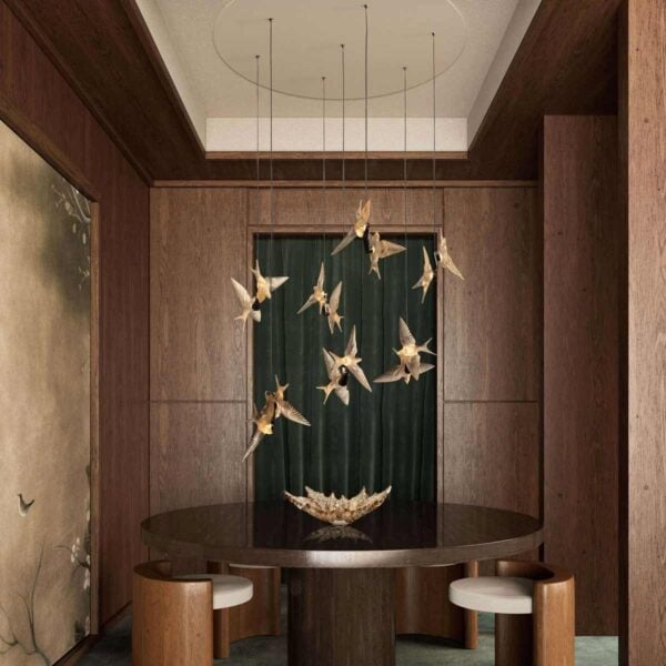 Luxurious dining room featuring the Lalique 2 Swallows Ceiling Lamp Clear Crystal & Gilded Finish in a satin gold finish | Kneen & Co