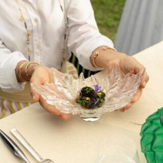 Elegant outdoor dining setting featuring the Lalique Champs-Élysées Small Bowl in clear crystal | Kneen & Co