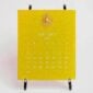 The Printery 2027 Calendar - Chartreuse, white text with starburst engraved in gold | Kneen & Co