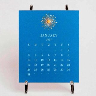 The Printery 2027 Calendar - Cornflower, white text with starburst engraved in gold | Kneen & Co