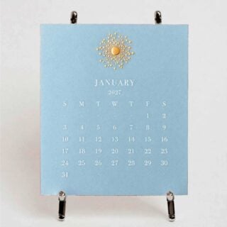The Printery 2027 Calendar - Fog, white text with starburst engraved in gold | Kneen & Co