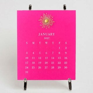 The Printery 2027 Calendar - Hot Pink, white text with starburst engraved in gold | Kneen & Co
