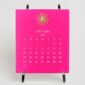 The Printery 2027 Calendar - Hot Pink, white text with starburst engraved in gold | Kneen & Co