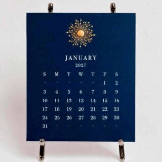 The Printery 2027 Calendar - Navy, white text with starburst engraved in gold | Kneen & Co