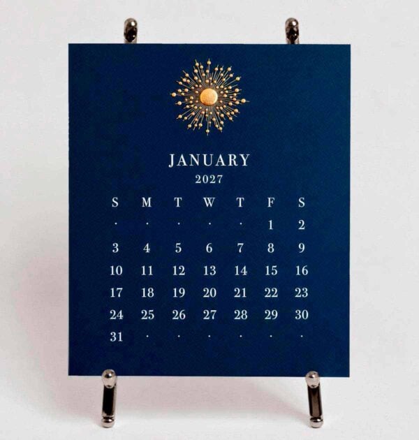 The Printery 2027 Calendar - Navy, white text with starburst engraved in gold | Kneen & Co