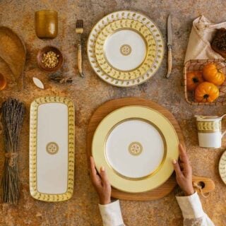Bernardaud Constance Jaune Dinnerware set on table | Kneen & Co