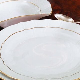 Herend Golden Edge Dinnerware set on table