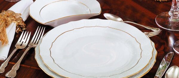 Herend Golden Edge Dinnerware set on table